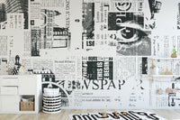 Monochrome newspaper style wall mural with bold typography layout.