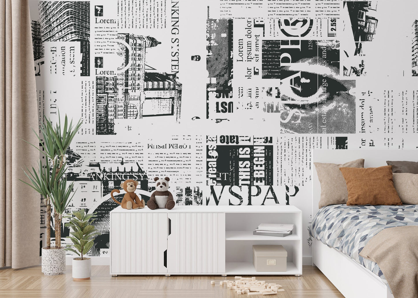 Grayscale newspaper collage wall mural with bold letter graphics.