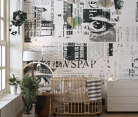 Graphic newsprint wallpaper featuring layered editorial textures.