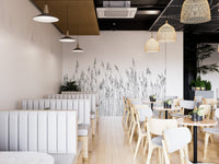 Grey plant wall mural used as a feature wall in a modern cafe or restaurant.