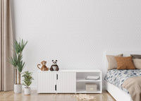 Minimalist kids bedroom with indoor plants with gray geometric wallpaper.