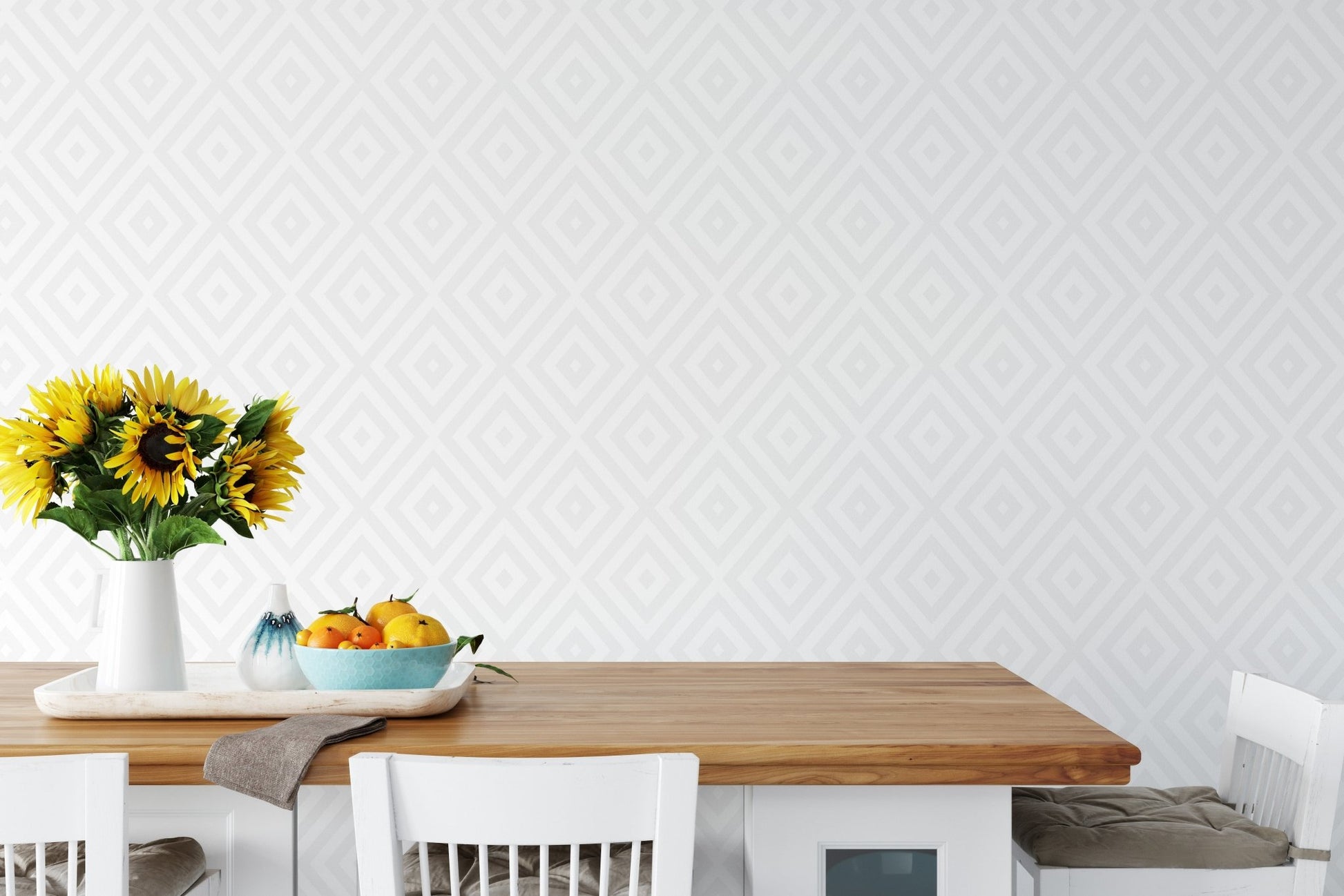 Dining table with yellow accents and a faint diamond pattern wallpaper background.