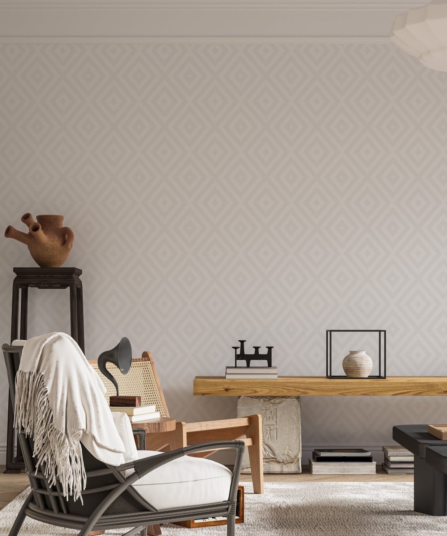 Contemporary living area with a dark armchair and gray geometric wallpaper.