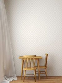 Simple wooden dining set against a subtle concentric diamond pattern wallpaper.