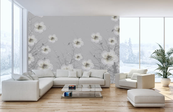 Large scale floral wall mural in a spacious white living room with sectional sofa.