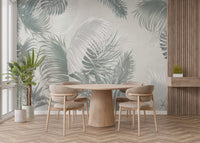 Large scale leaves print wall mural in a modern dining room with a round table.