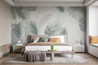 Grey and green botanical wall mural behind a king-size bed in a neutral bedroom.