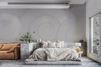Textured grey background mural with large radial spiral elements in living area