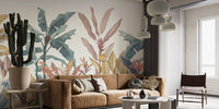 Bohemian style sitting room with large green palm leaf wall mural and tan leather sofa.