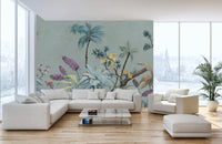 Large living space featuring sage green tropical wall mural and white sofa.