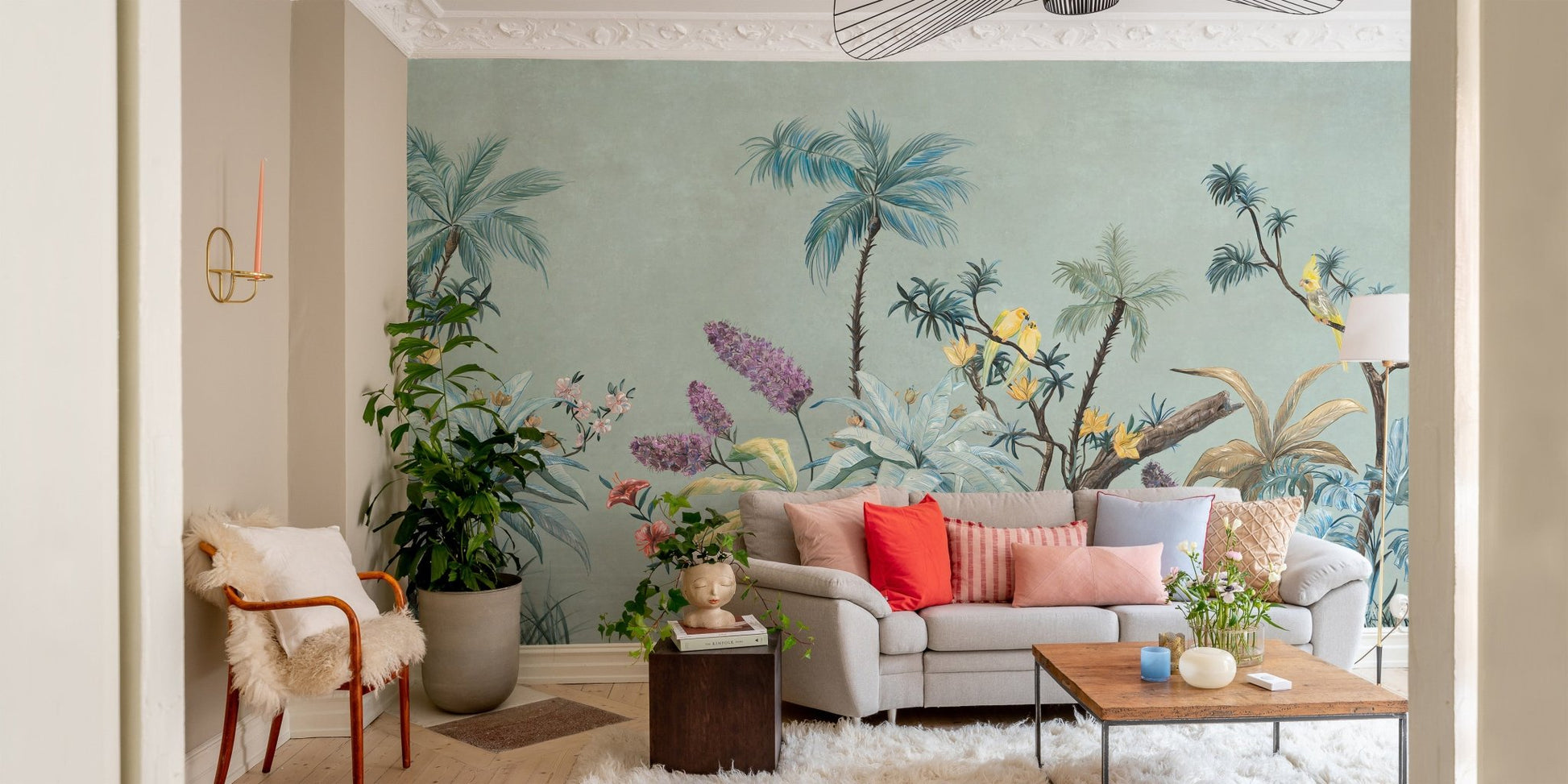 Green background boho mural in contemporary living space.