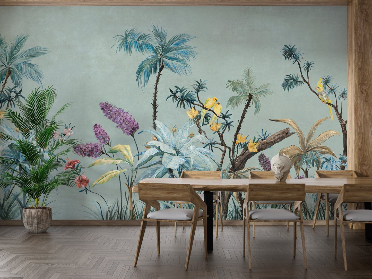 Dining area featuring green tropical wall mural and light wood chairs.