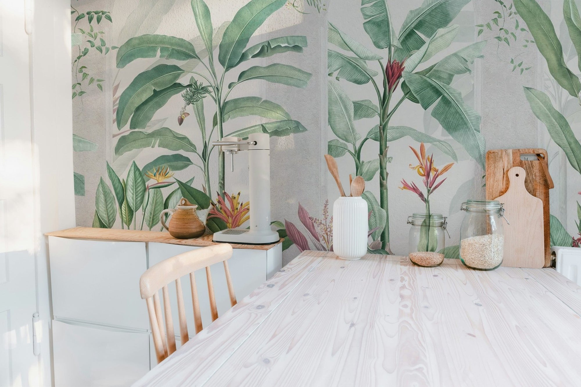 Green banana leaf tropical wallpaper with arched stone window motifs.