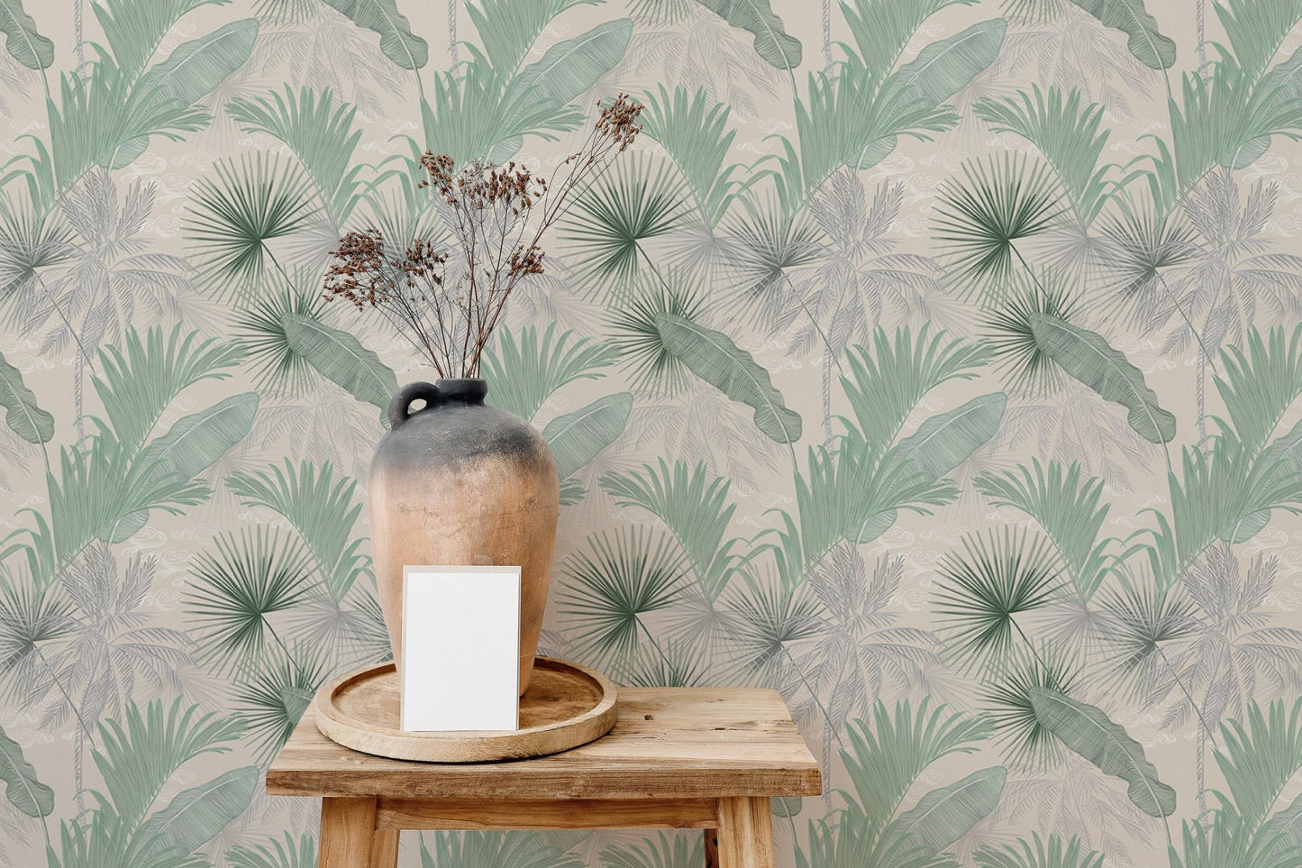 Botanical leaves wallpaper behind a wooden stool and decorative vase.