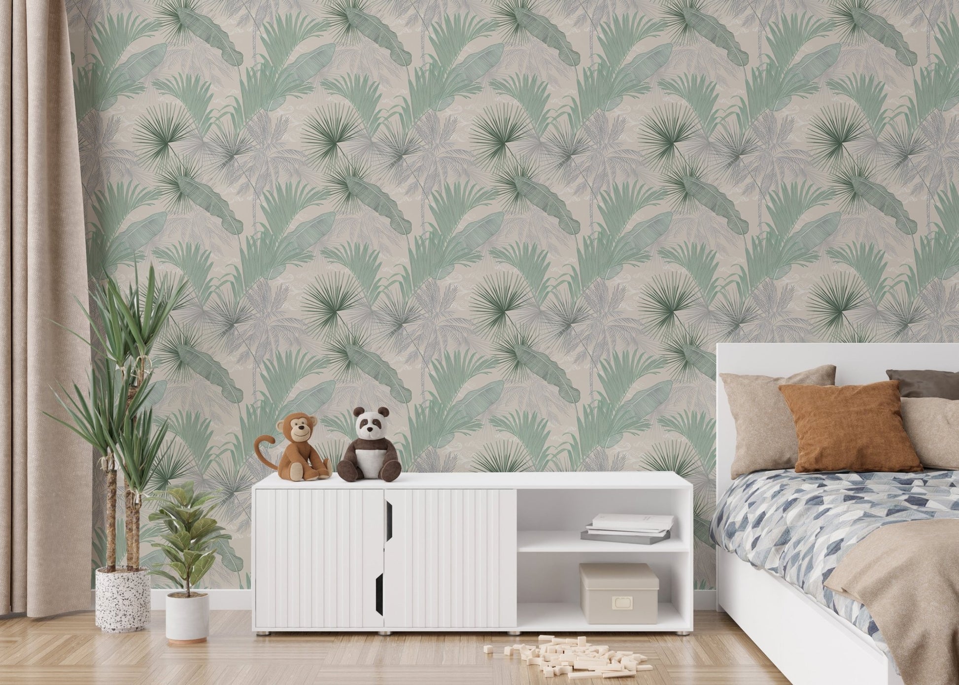 Sage green leaf wallpaper in a bedroom behind a white sideboard and bed.