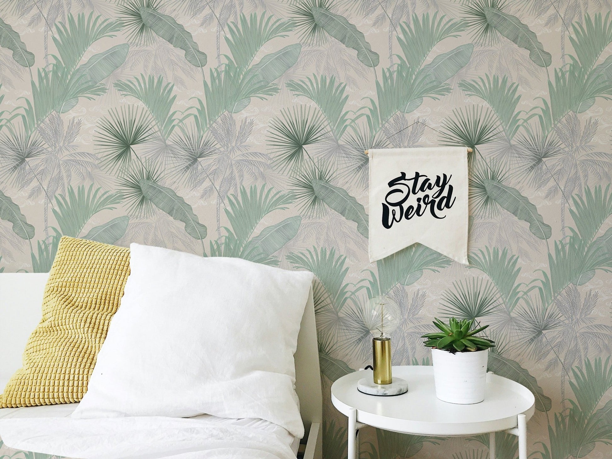 Green Banana Leaves Seamless Pattern Wallpaper in a bedroom with white bedding.