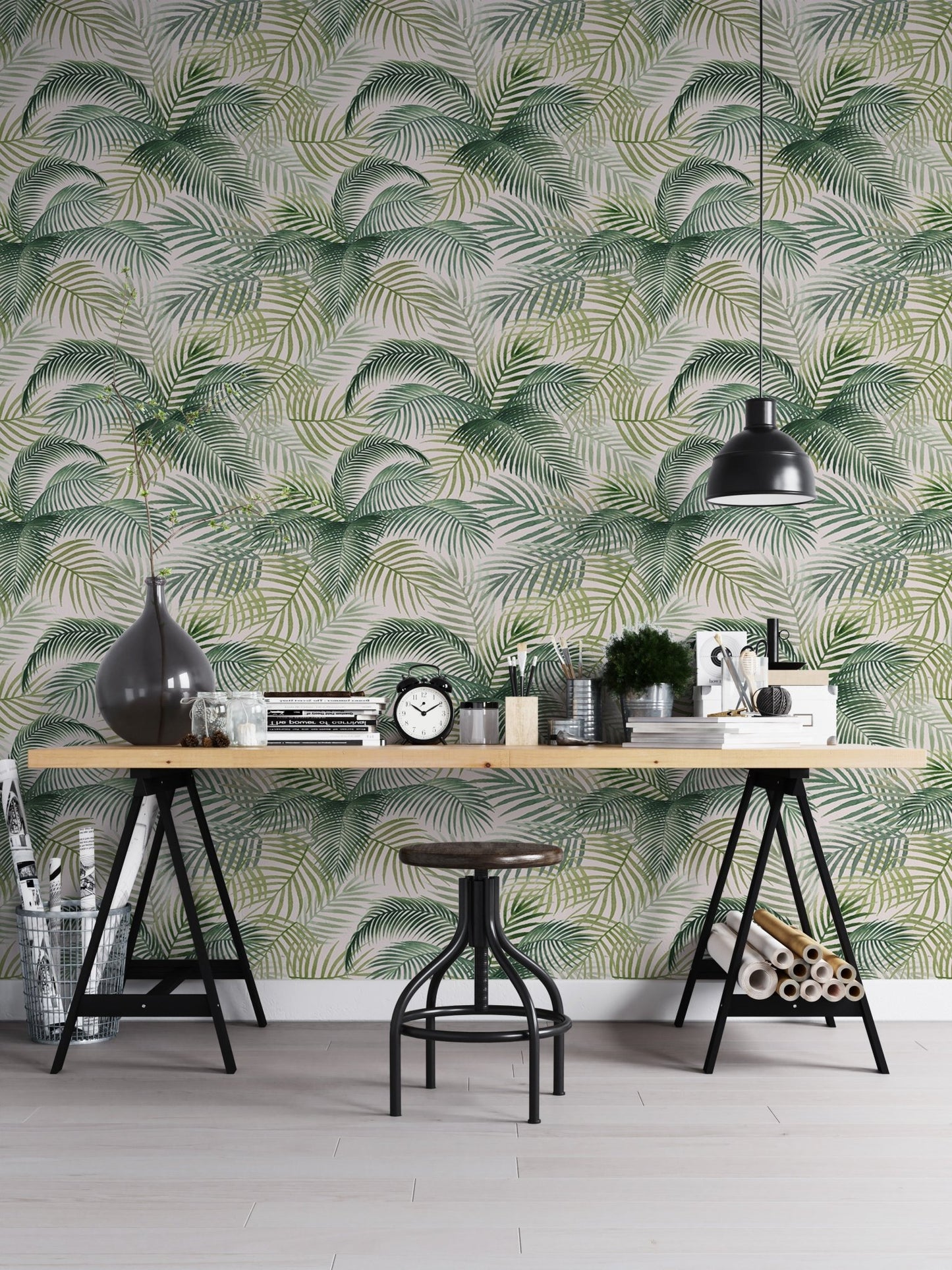 Tropical pattern wallpaper in a home office with a black industrial desk.