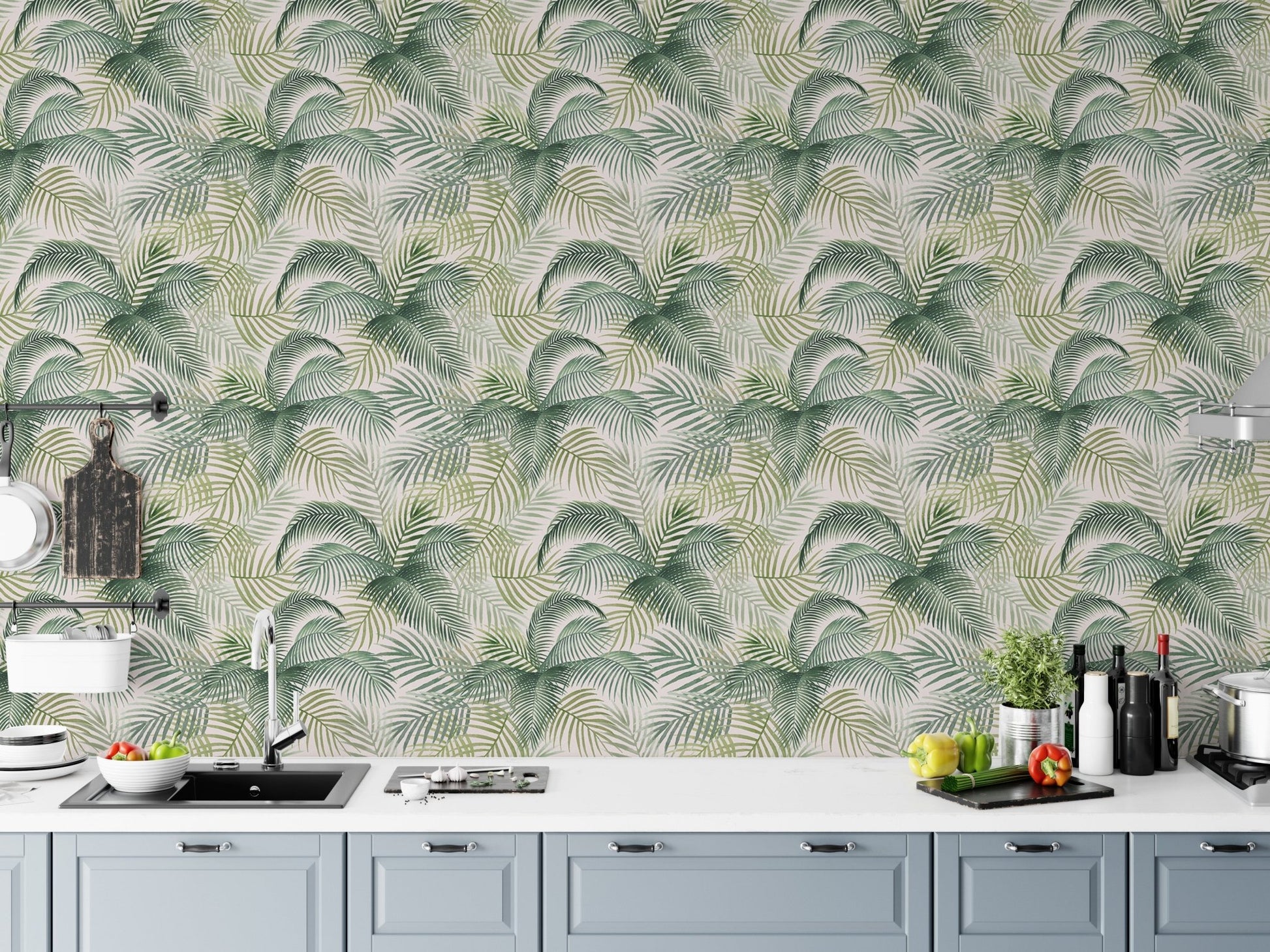 Botanical repeat pattern wallpaper in a white kitchen above a marble countertop.