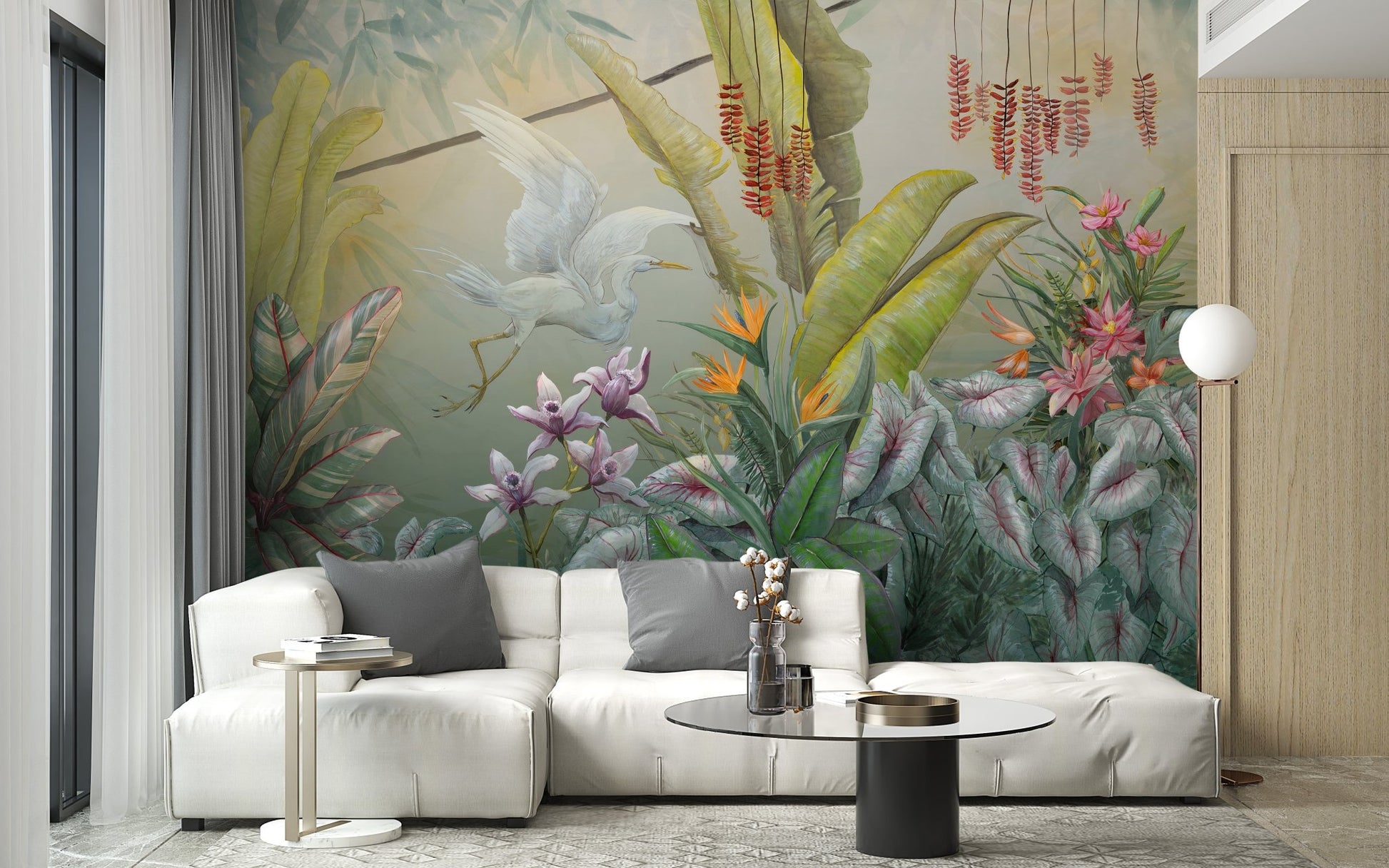 White modular sofa placed against a flower and crane pattern wall mural.
