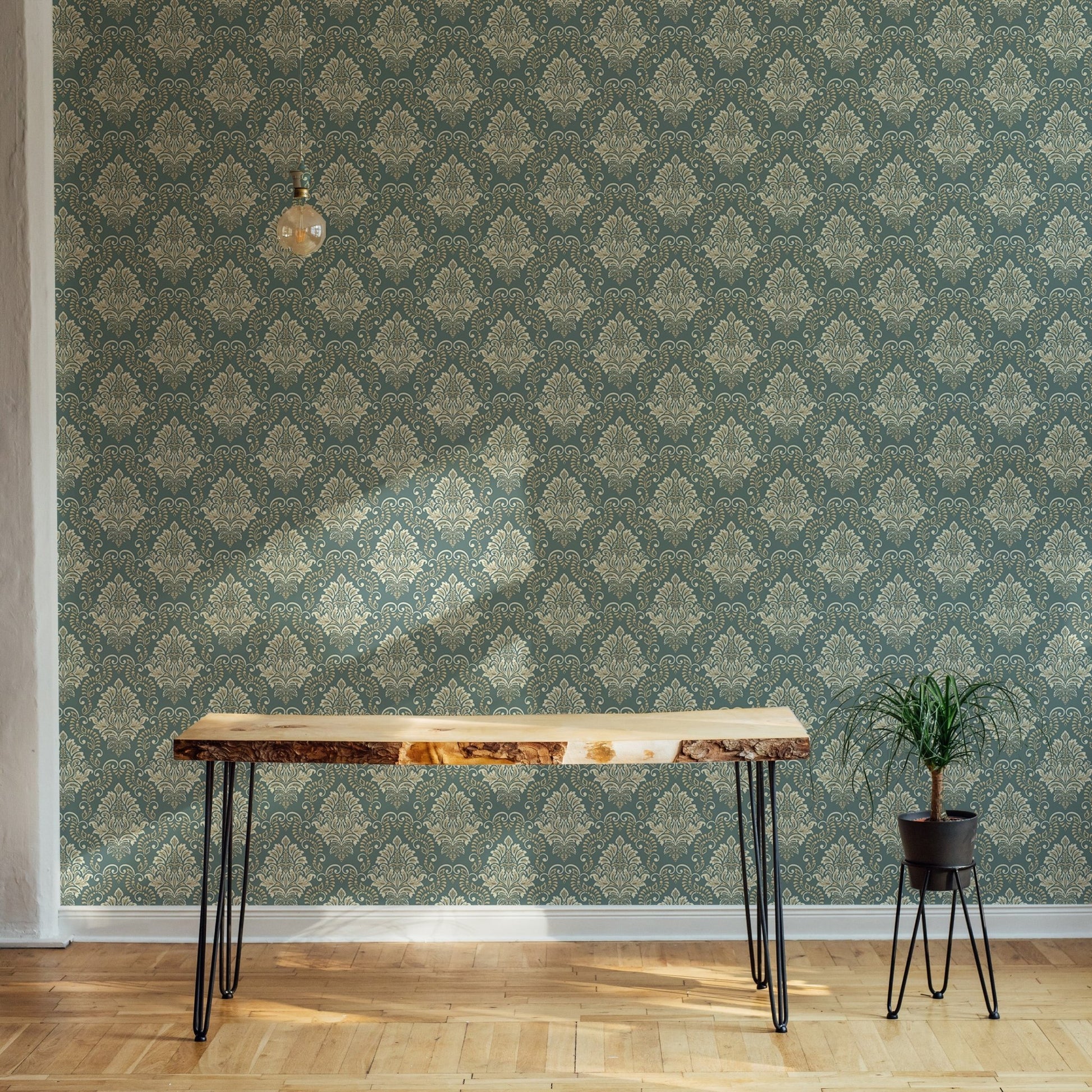 Vintage design wallpaper behind a wooden console table in a minimalist hallway.