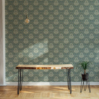 Vintage design wallpaper behind a wooden console table in a minimalist hallway.
