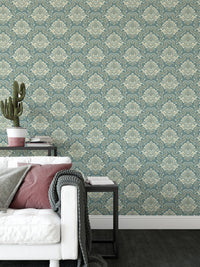 Green Vintage Baroque Damask Design Wallpaper in a living room with a white sofa.