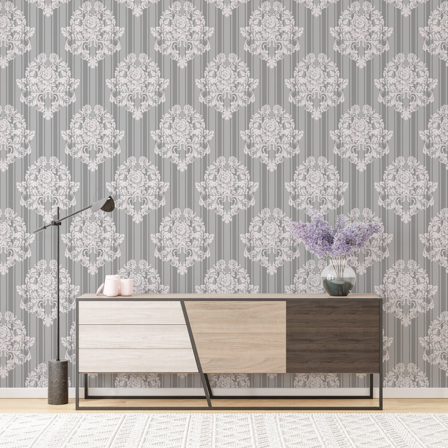 Vintage ornaments damask pattern wallpaper behind a modern wooden sideboard.