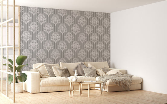 Damask wallpaper behind a white sofa in a bright living room.
