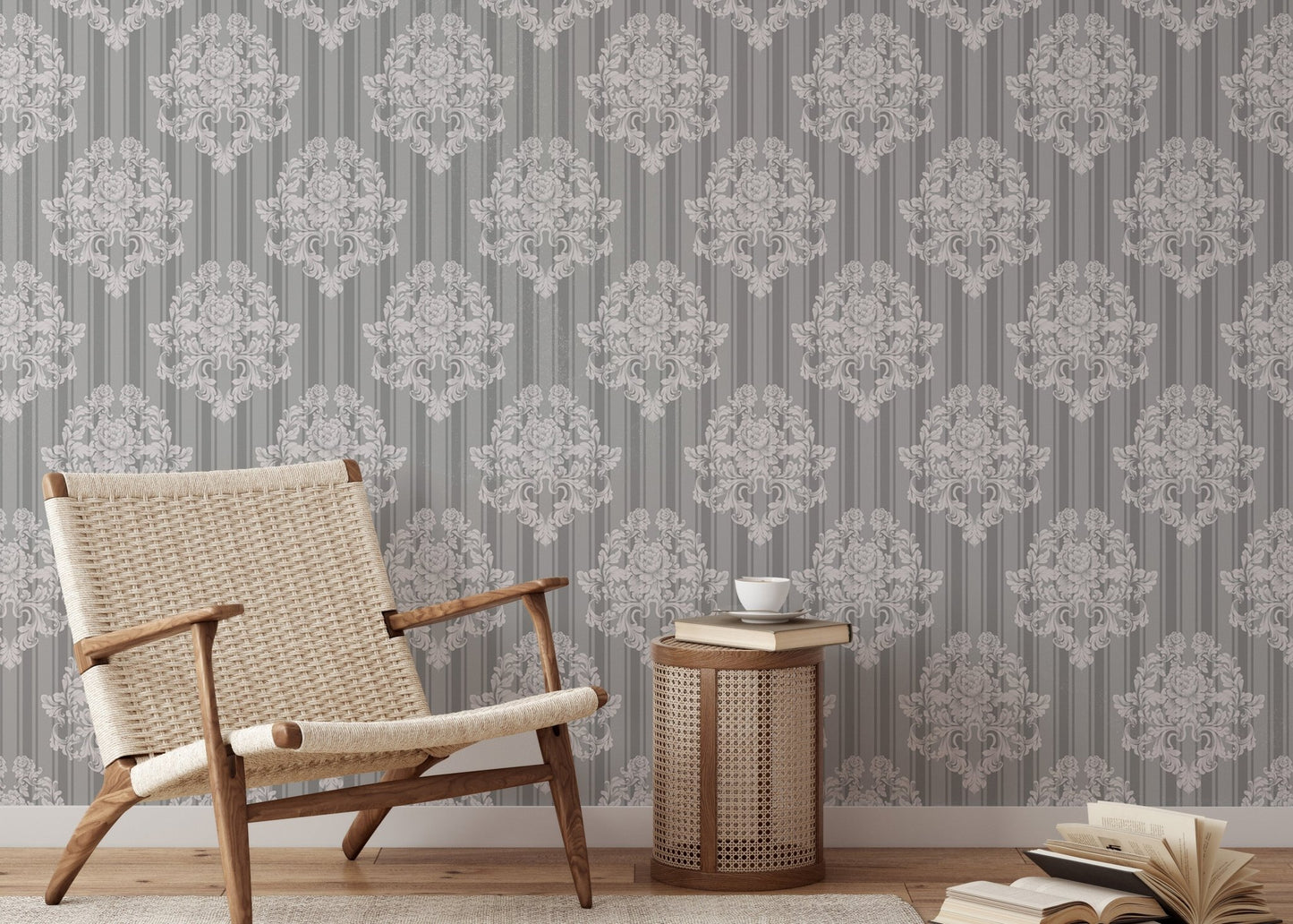 Grey damask wallpaper in a reading area with a woven chair.