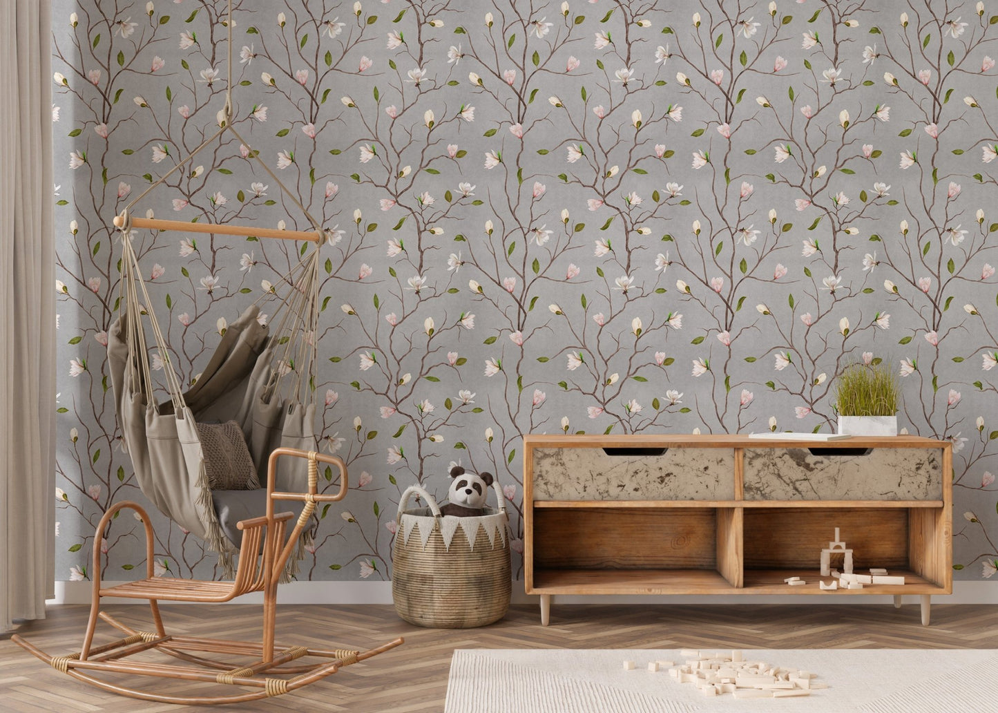 Chinoiserie wallpaper with pink flowers behind a wooden rocking chair.