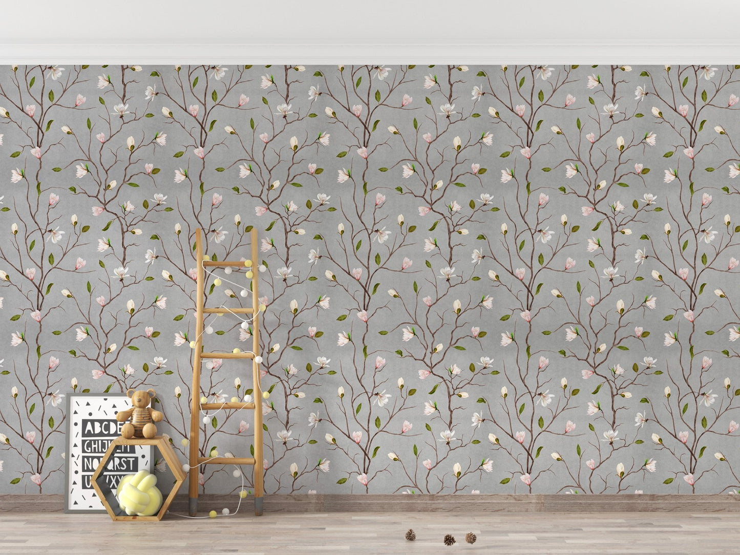 Floral pattern wallpaper on a grey wall in a playroom with wooden toys.