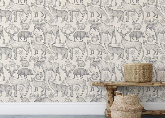 Grey color animals and plants removable wallpaper on a wall with a wooden bench.