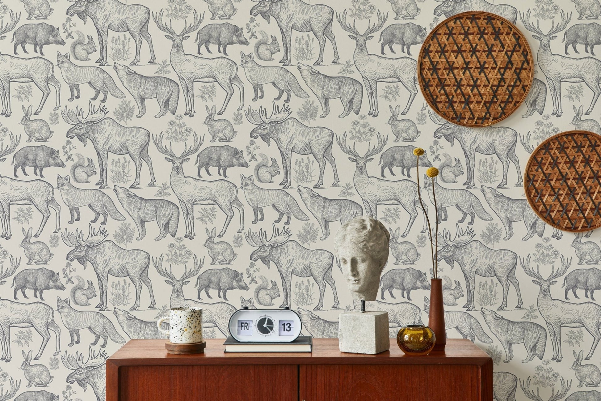 Removable wallpaper in grey tones with nature motifs for reading space.