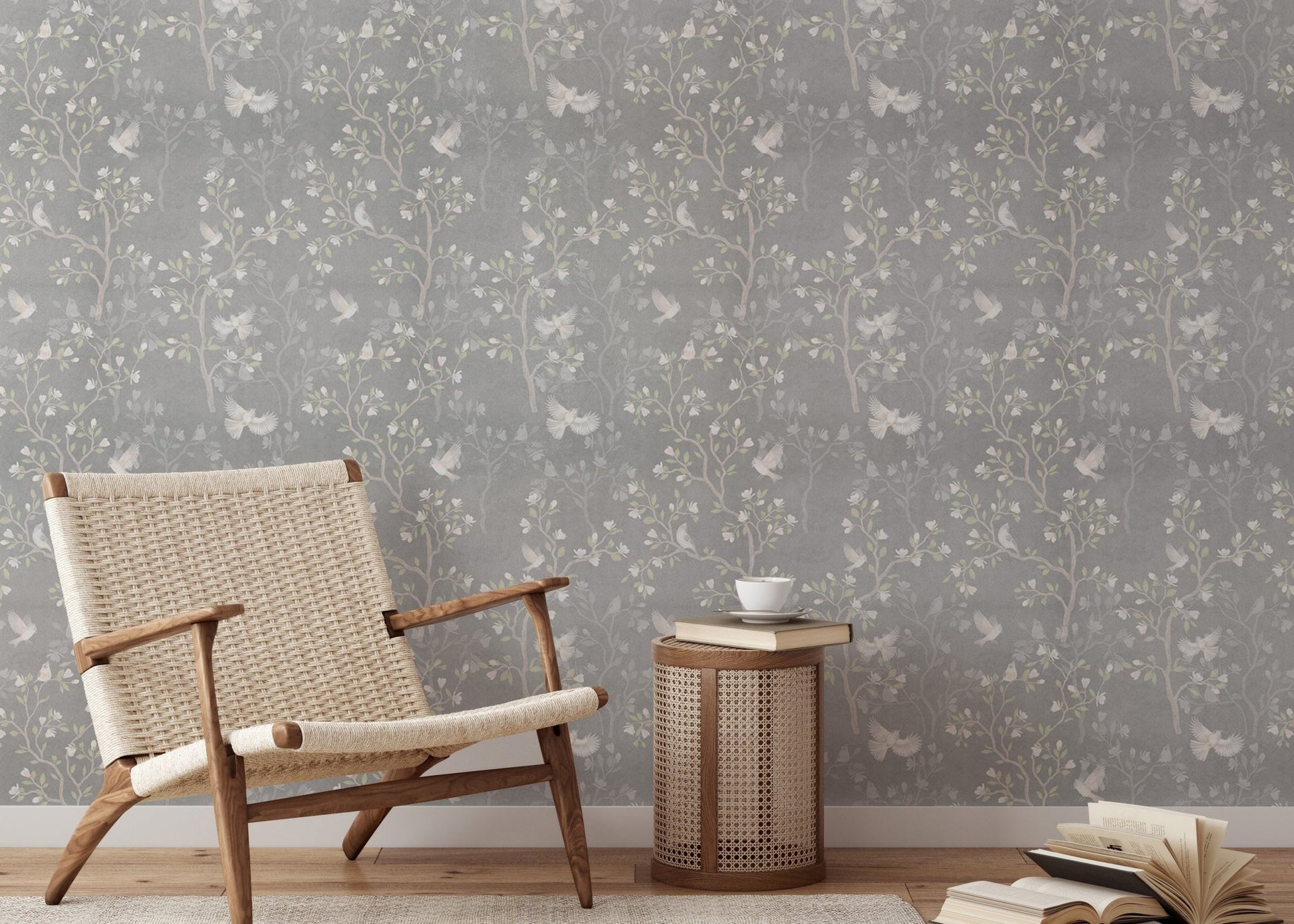 Magnolia tree wallpaper in a minimalist reading room with a mid-century chair.