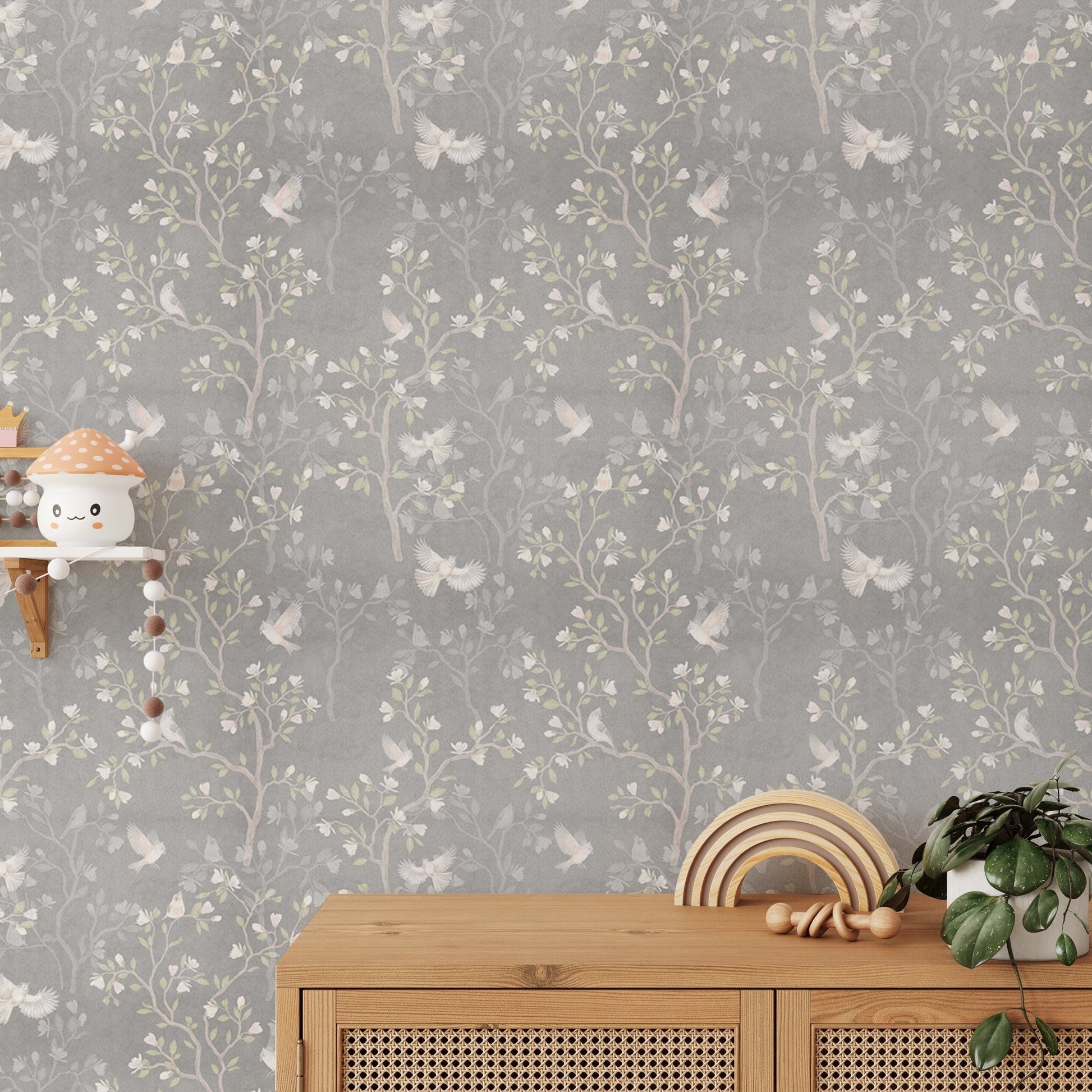 Grey Chinoiserie wallpaper used as a feature wall in a sunlit bedroom.