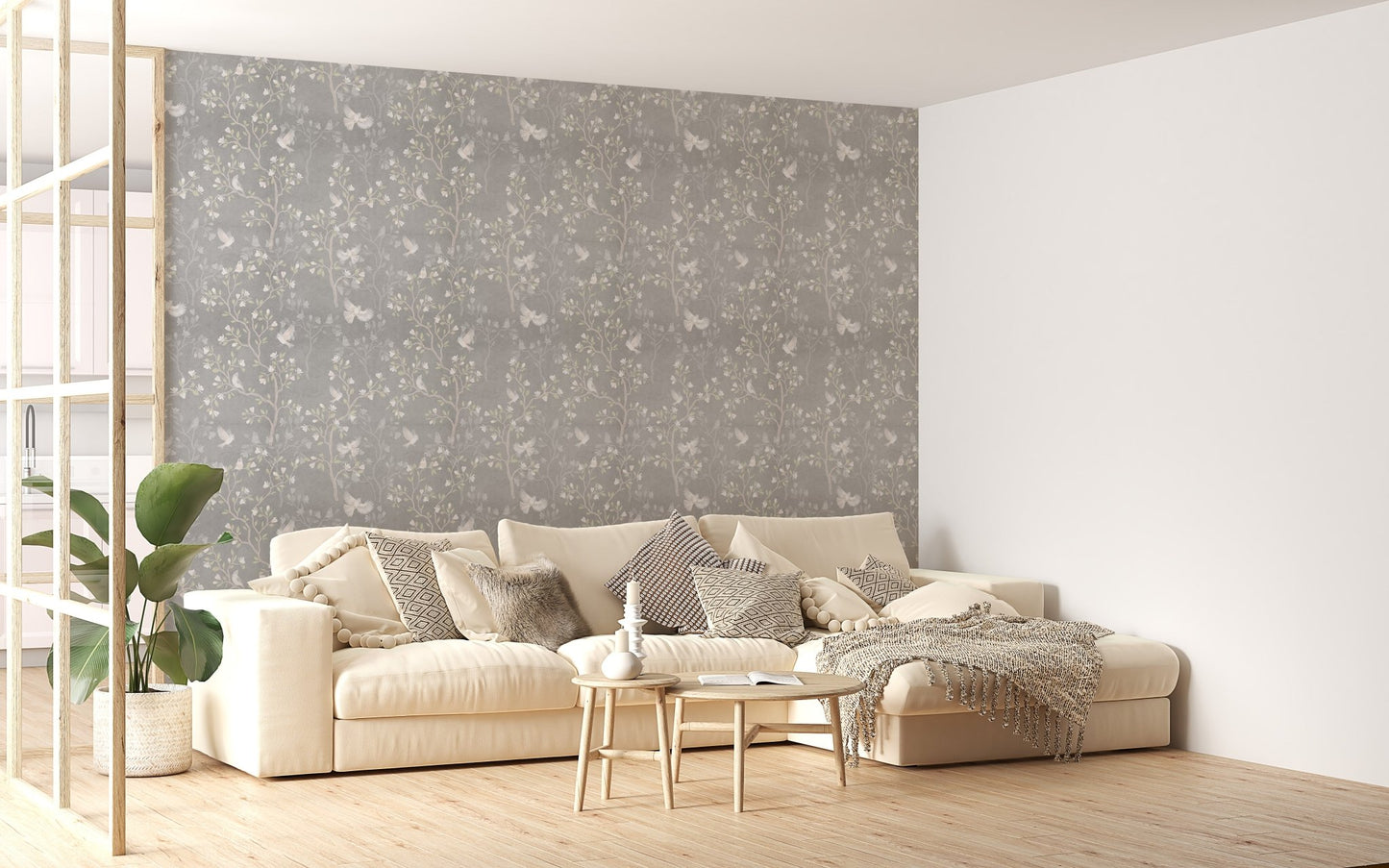 Large living space featuring a grey magnolia tree wallpaper with a white sofa.