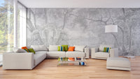 Large grey tree sketch wall mural in a modern living space with a white sectional sofa.