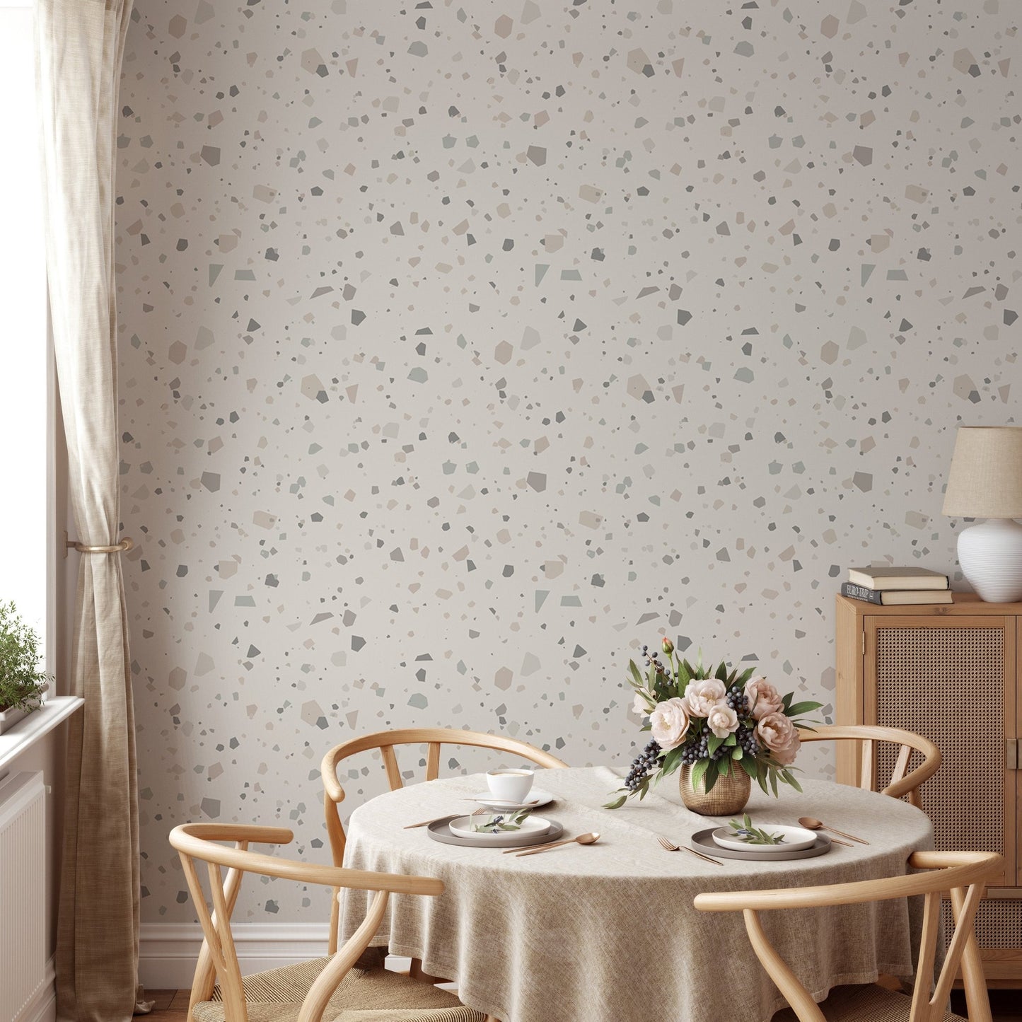 Grey and beige speckled wall mural in a living room with flowers.