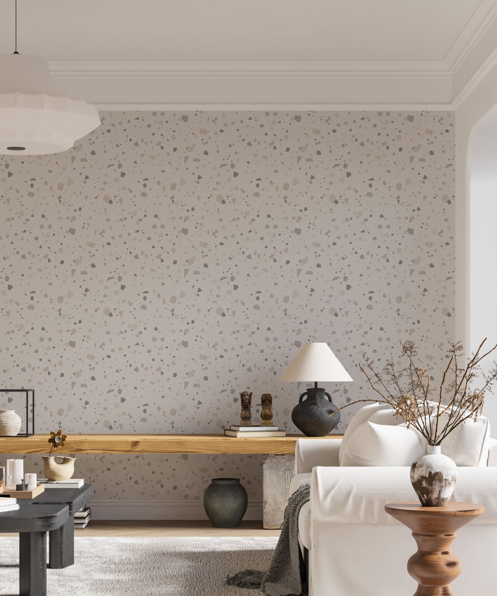Beige terrazzo wall mural behind a wooden desk in a home.