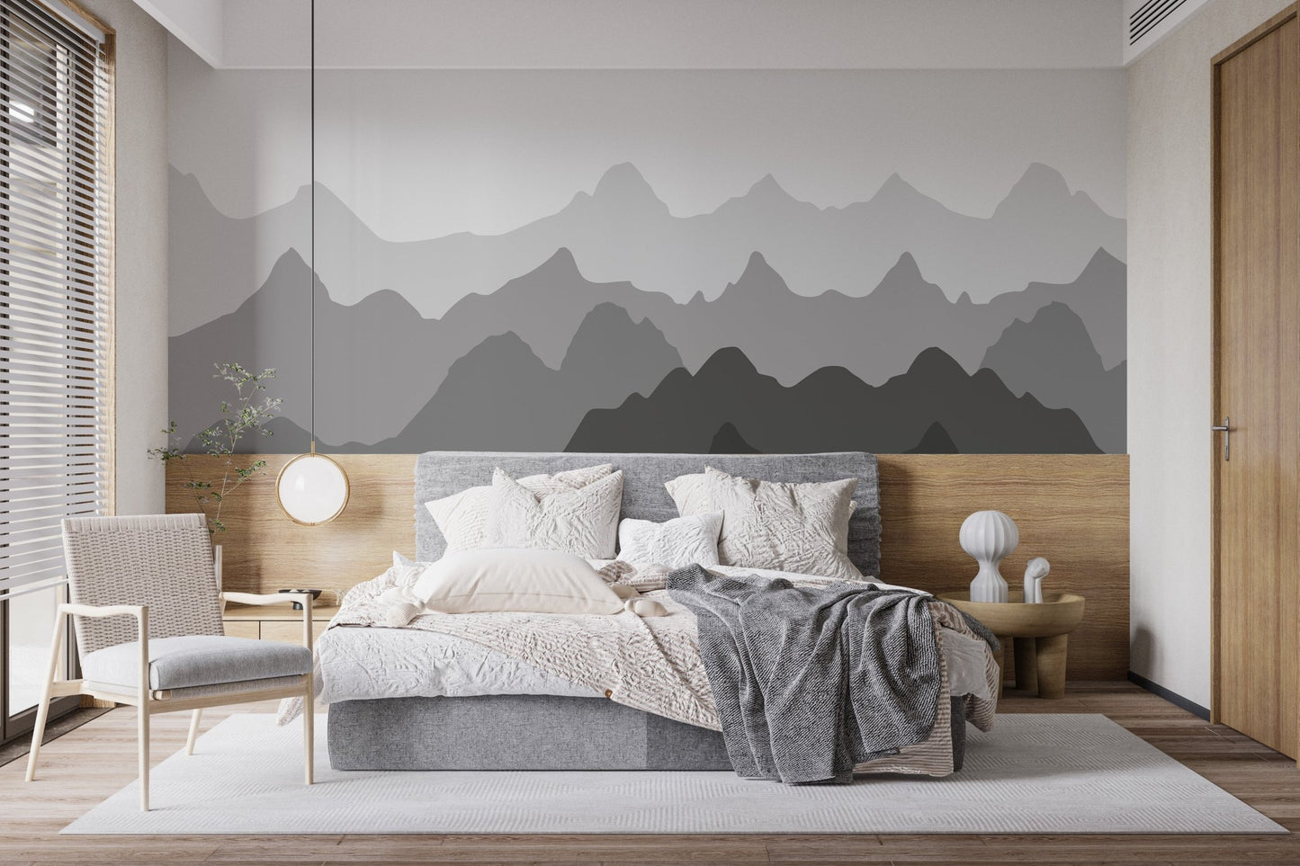Contemporary bedroom with mountain peak wall mural and soft grey linens.