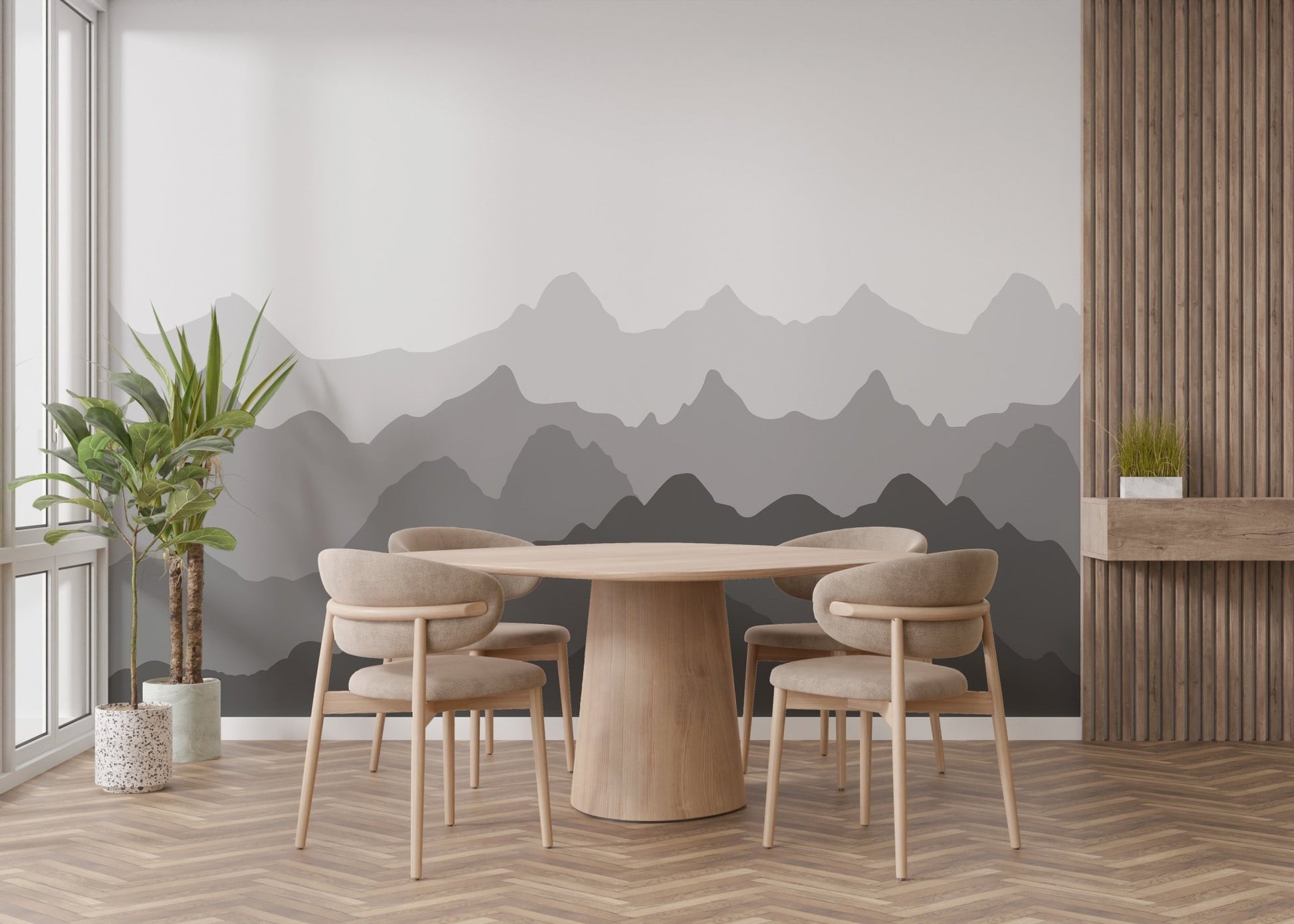 Circular wooden dining table set against a layered mountain wall mural.