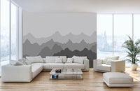 Minimalist white living space featuring a grey mountain shadows wall mural.