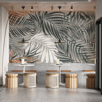 Restaurant interior with a palm leaves wall mural.