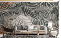 Contemporary seating area with a grey tropical wall mural.