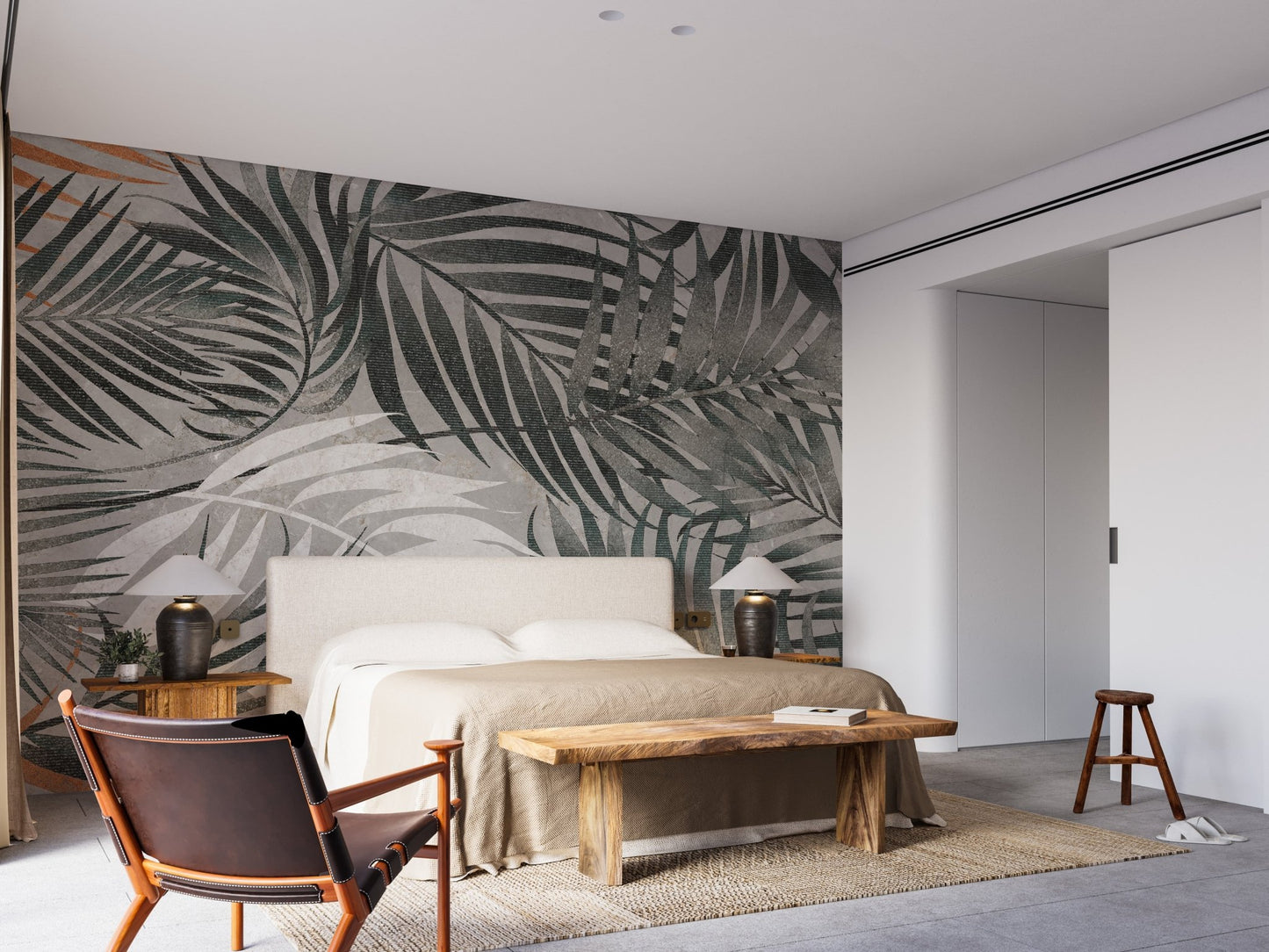Minimalist bedroom with a large palm leaves wall mural.