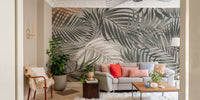 Spacious living room featuring a tropical leaves wall mural. 