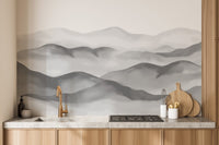 Grey watercolor peaks wallpaper with misty mountain silhouettes.