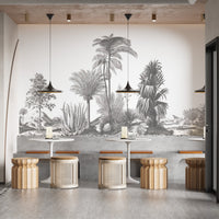 Grey-themed palm mural with a tranquil feel in restaurant dining space.