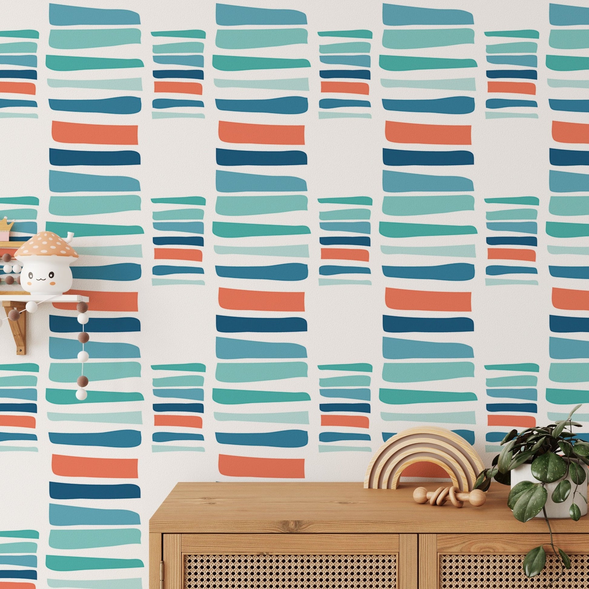 Abstract teal and orange stripe wallpaper behind a wooden cabinet and potted plant.