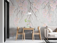 Floral branches on soft pink wall mural in minimalist dining room.